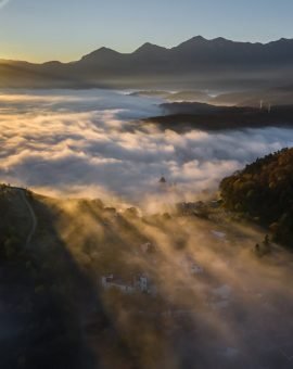 Aerial view of misty sunrise behind Tampa, Brasov, Romania